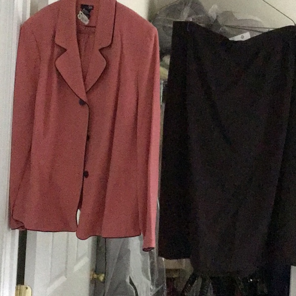 like new, dry cleaned, coral jacket w brown piping